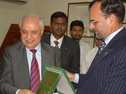 Mr. Talal Abu-Ghazaleh receiving an honorary shield from ...