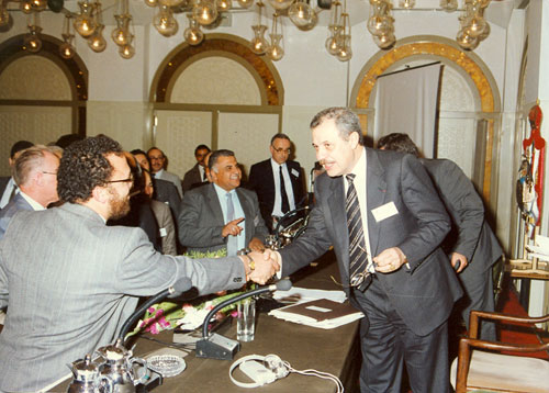 Chairman Abu-Ghazaleh shakes hands with participants at the ...