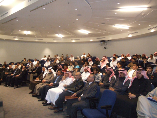 Part of the audience listening to a lecture 