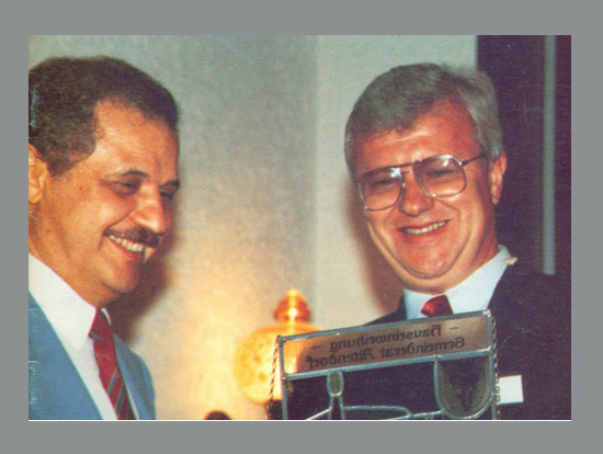 Presenting a commemorative shield to Mr. Talal Abu-Ghazaleh ...