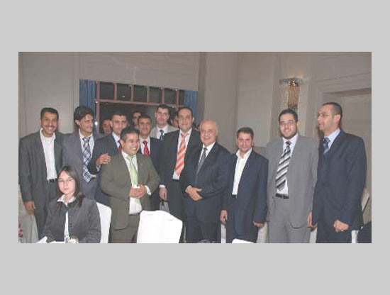 Employees in a commemorative photo wi